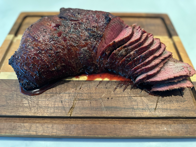 juicy, cut, tri-tip on a cutting board